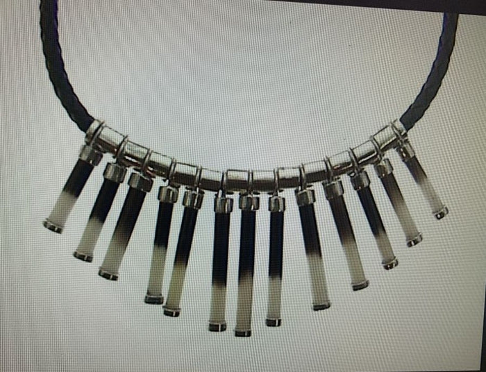 Necklace of porcupine quill sections, cut and capped in silver, on a black cord