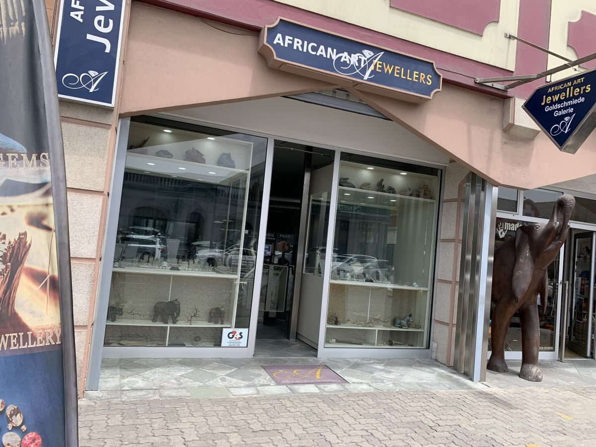 African Art Jewellers gallery on Sam Nujoma Avenue, Swakopmund: the pink shopfront with our sign